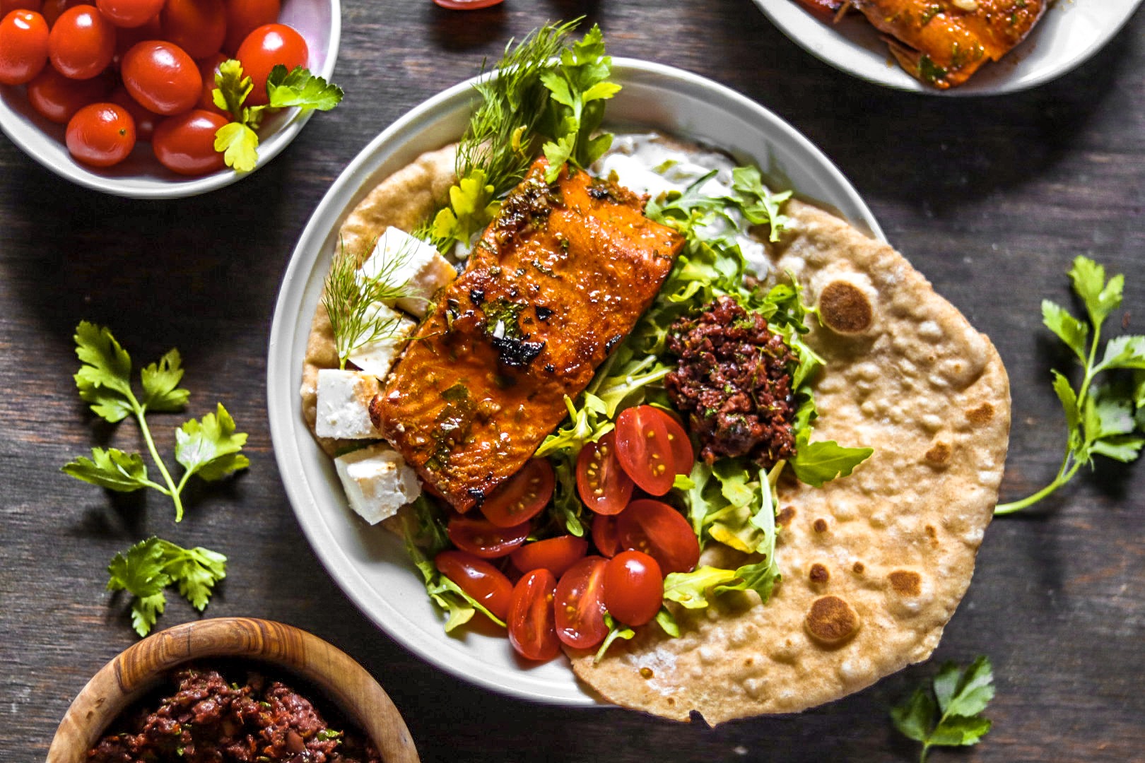 salmon souvlaki with herby sundried tomato olive tapenade