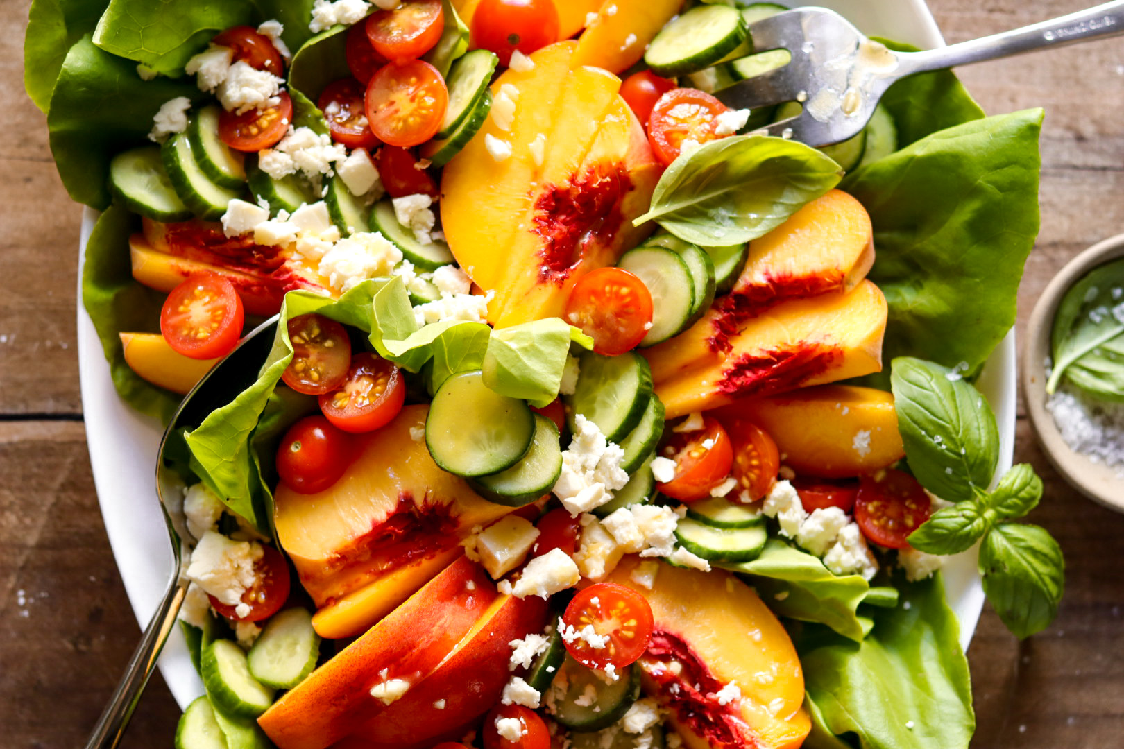 tomato, peach, and cucumber feta salad with honey mustard dressing